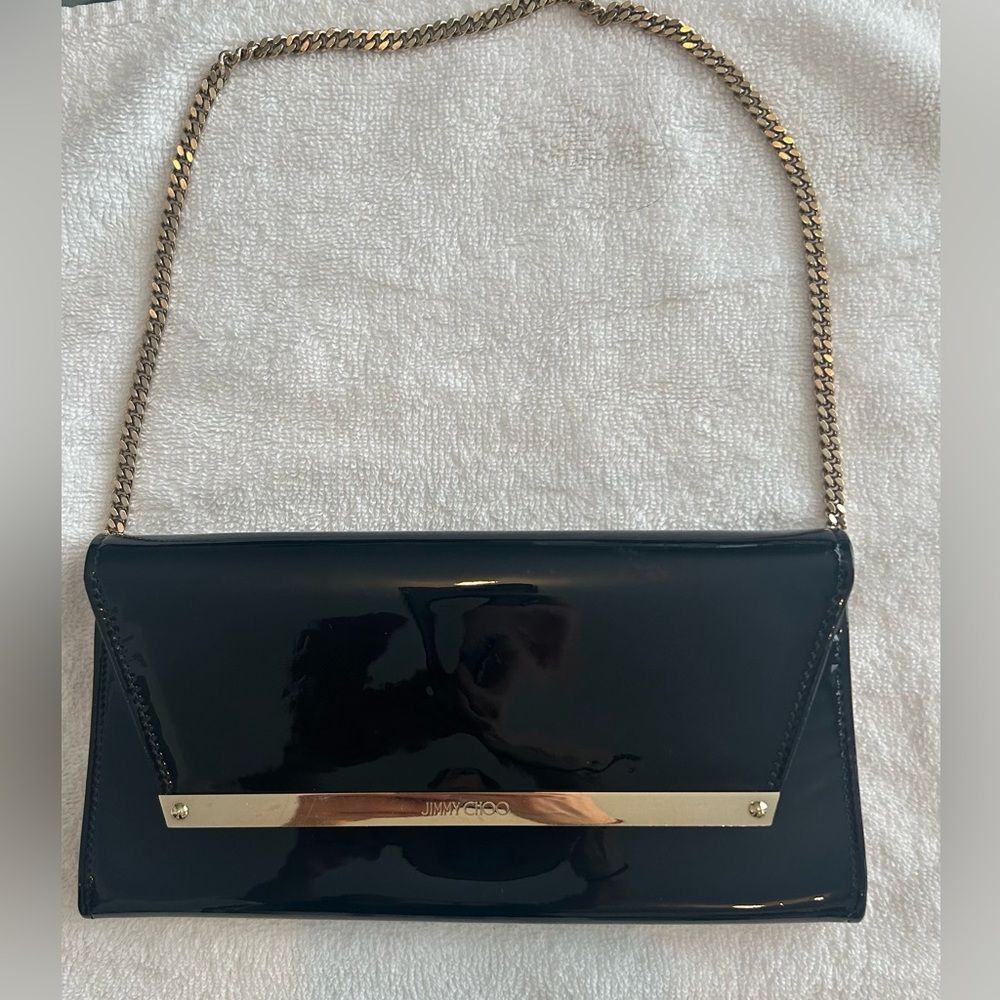 Jimmy Choo Authentic Clutch with Chain. Black with gold hardware.